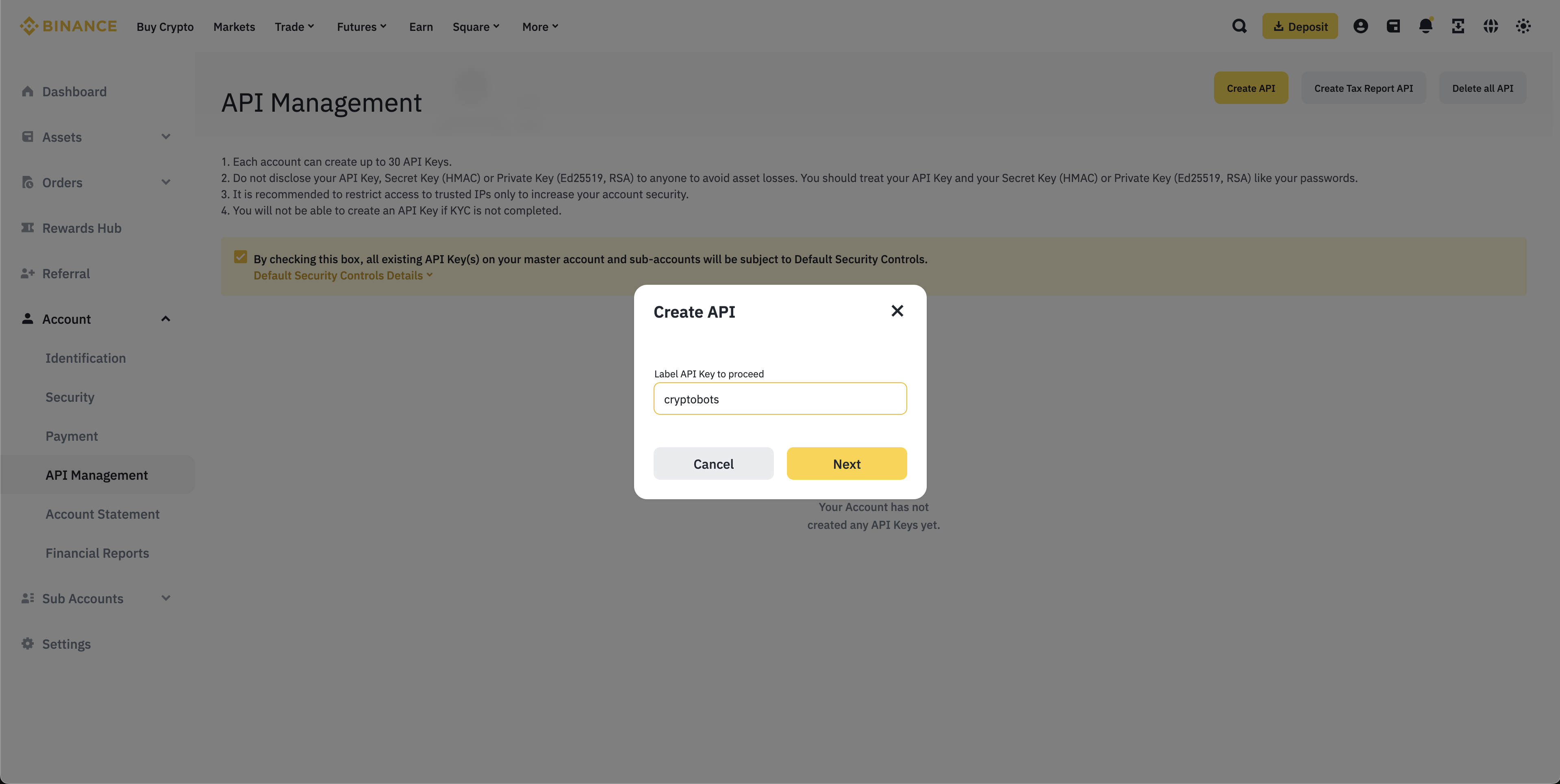 Binance 'Create API Key' modal prompting for API key name, with 'Cryptobots' entered